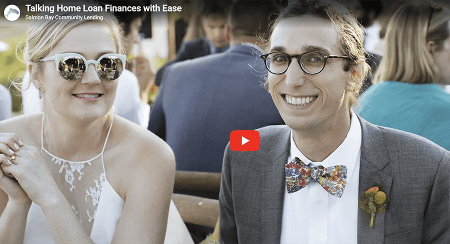 Happy couple discussing home loans at an outdoor event in Seattle.