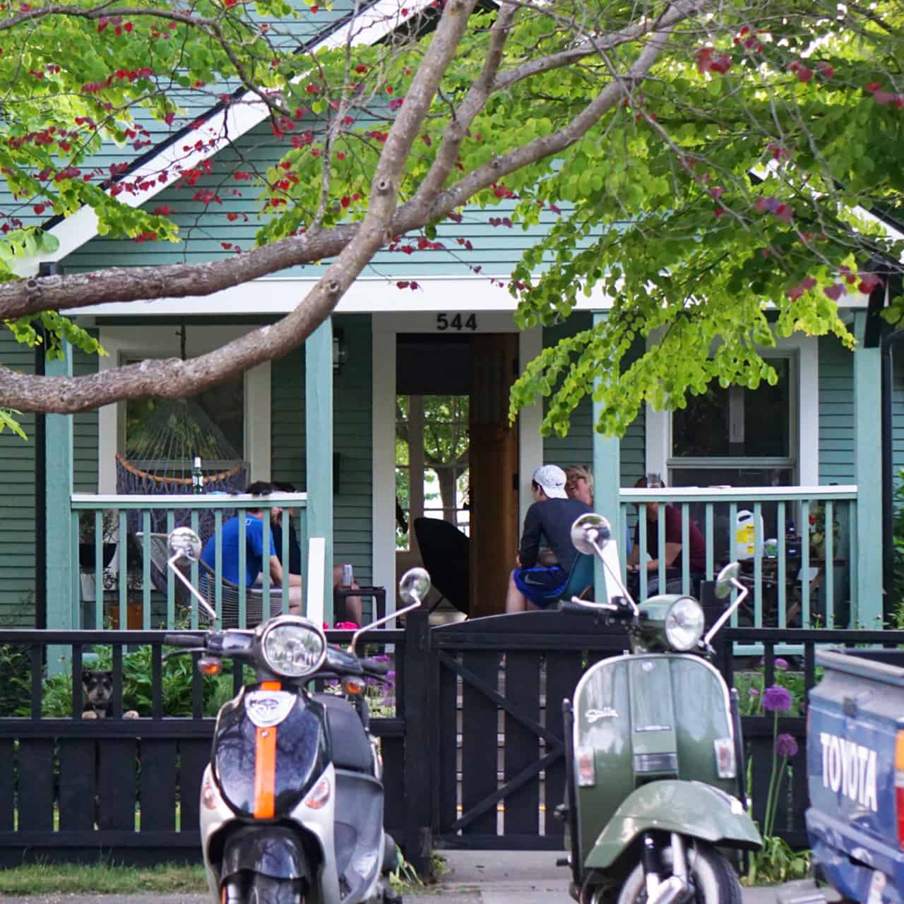 2 mopeds parked in front of seattle house